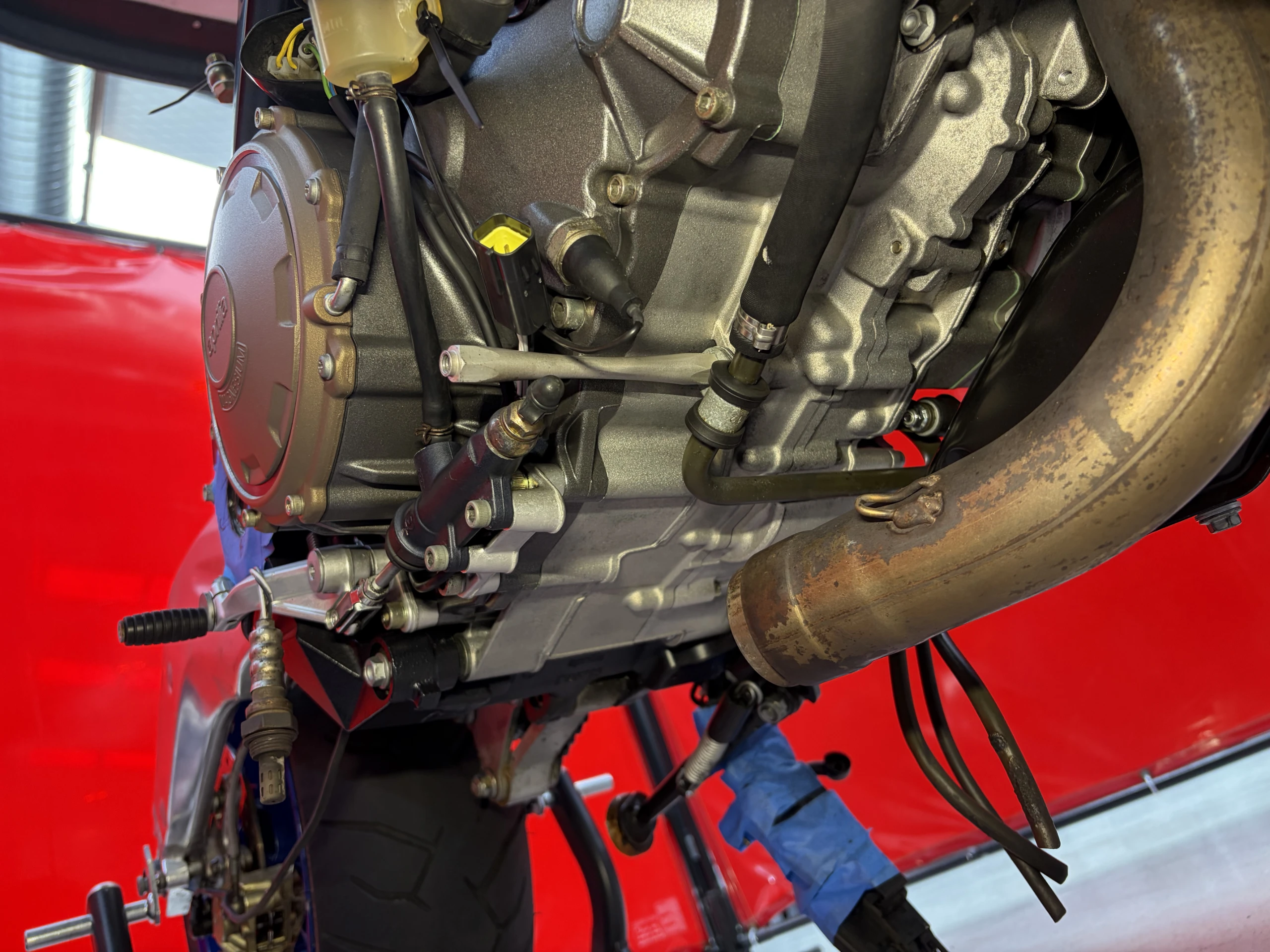 2005 Aprilia RSV1000R lower cases and header run after dry ice blasting, clean alloy with decals and anodising intact