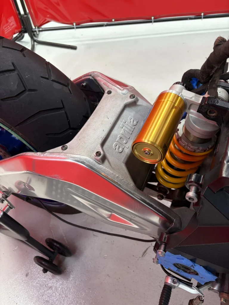Cleaned swingarm, chain run and Ohlins rear shock on a 2005 Aprilia RSV1000R after dry ice blasting