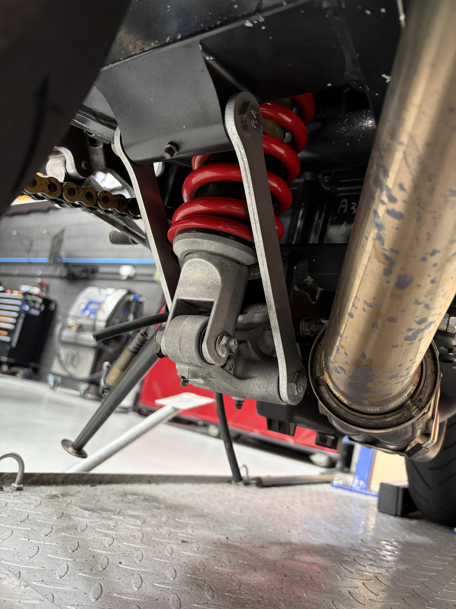 2004 Kawasaki ZX-12R rear shock, linkage and collector after dry ice blasting, clean with decals and anodising intact