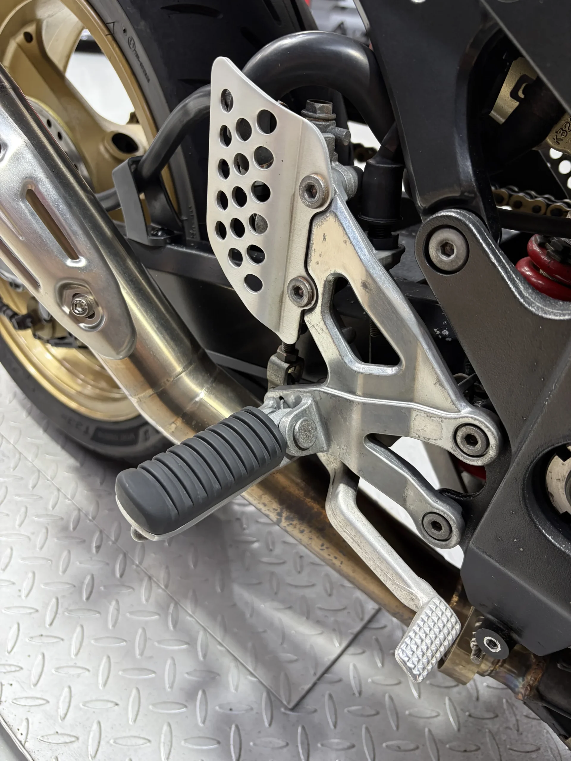 2004 Kawasaki ZX-12R rearsets, heel guard and exhaust after dry ice blasting, clean with decals and anodising intact