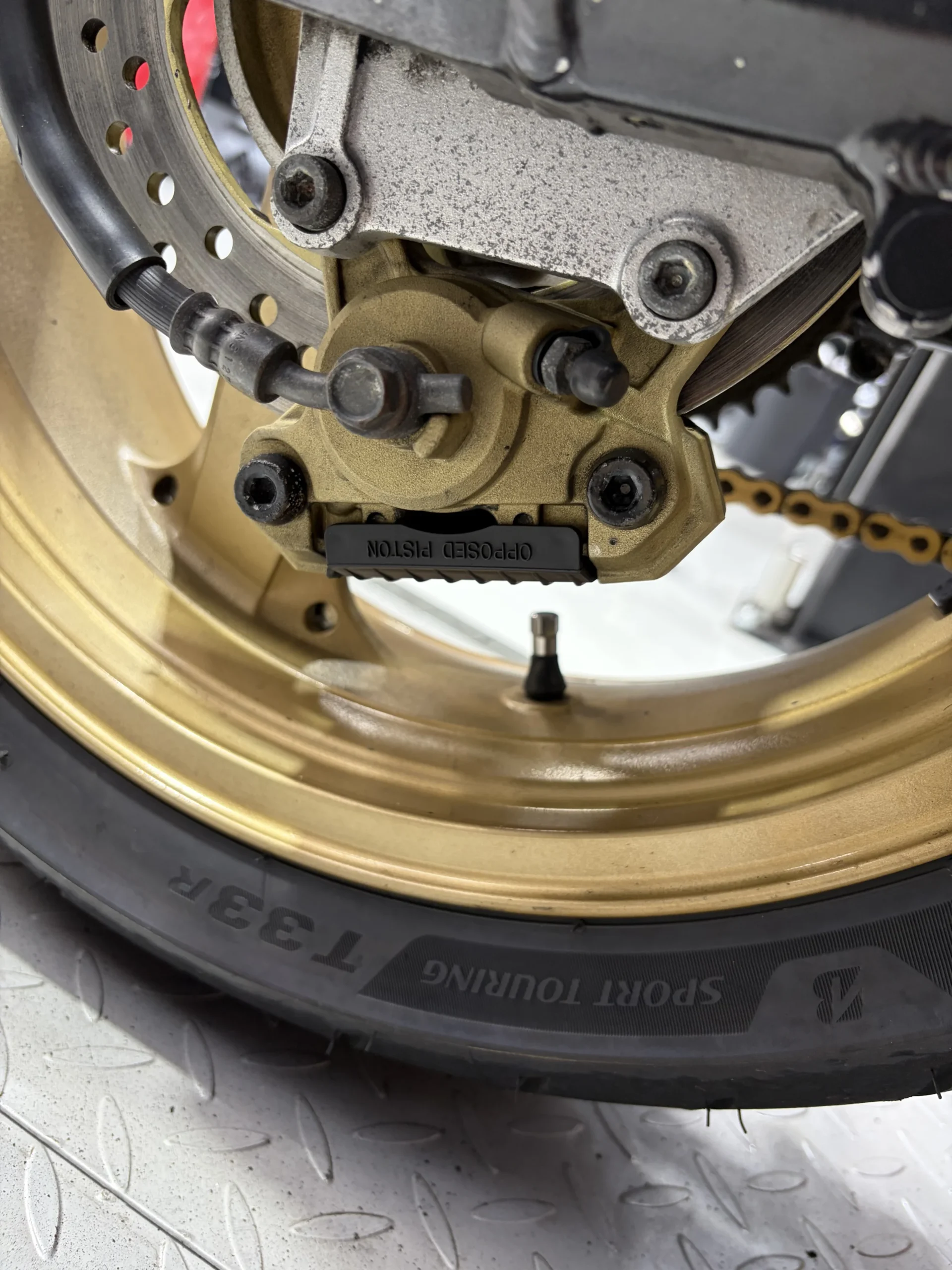 2004 Kawasaki ZX-12R front wheel, caliper and disc after dry ice blasting, clean with decals and anodising intact