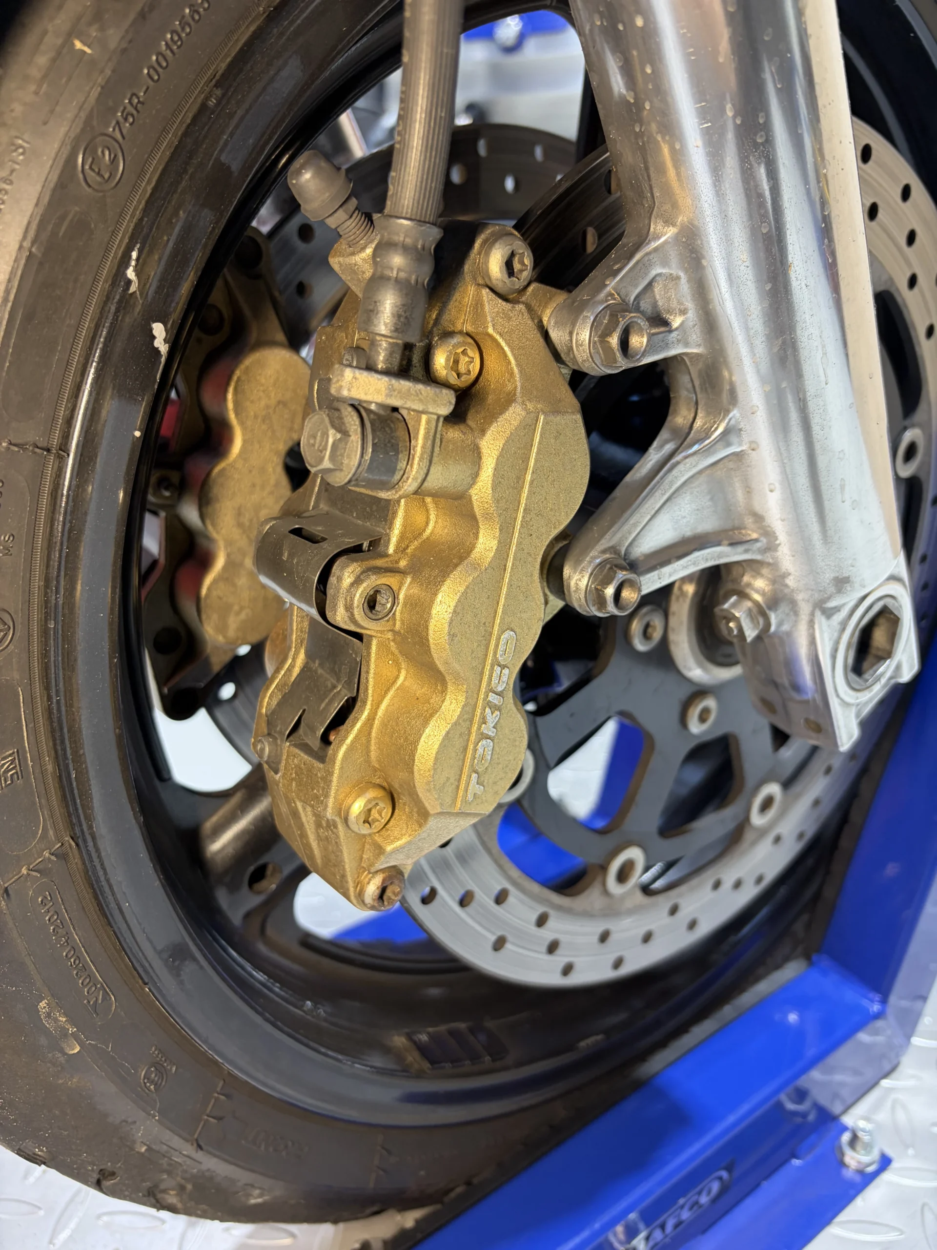 2007 Suzuki GSX1400 front wheel, caliper and fork before dry ice cleaning, under road film and oil mist