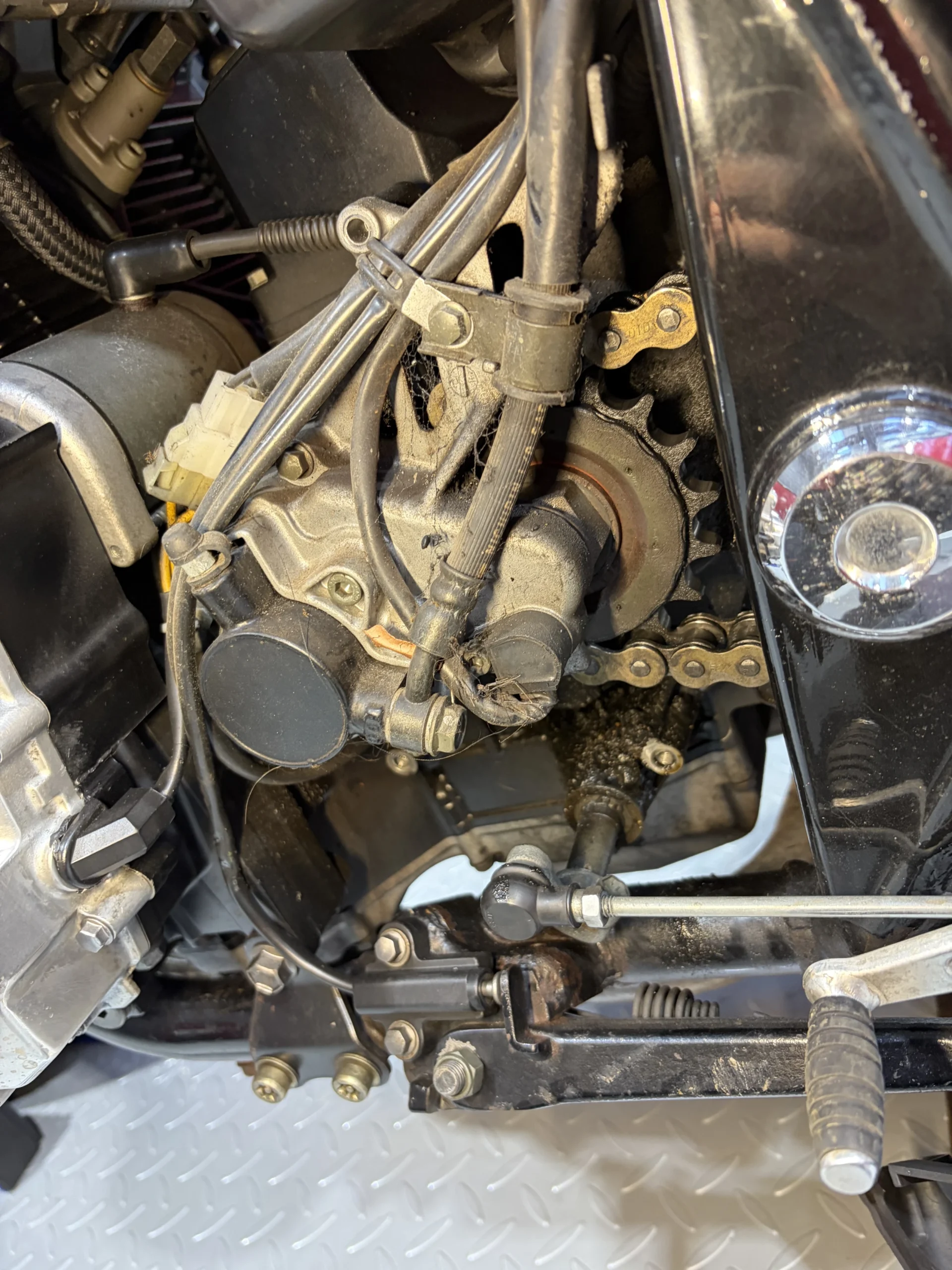 2007 Suzuki GSX1400 nearside engine, linkage and rearset before dry ice cleaning, under road film and oil mist